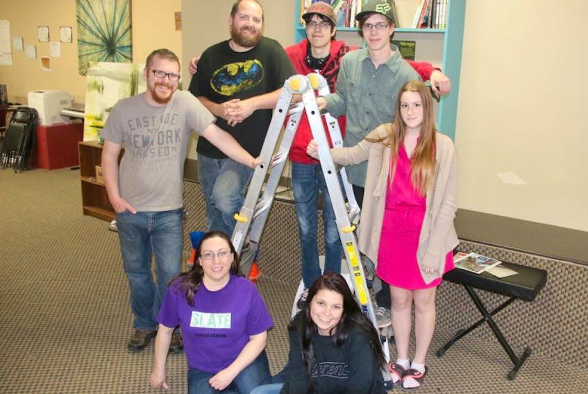 Getting ready for the open house has been a big focus at Slate Youth Centre during the past few days. Some of the workers and youth are, front, from left; Crystal Crossan-Zak, Kayla Landry; back, Evan Moxsom, Ian Cantle, Zach Burns, Kyle Hiltz and Holly Brown.
