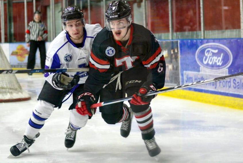 Truro defenceman Tyler Pyke battles against Brock McEwan of the Amherst Ramblers during Game 2 action on Monday in Amherst. Wednesday, the Bearcats host the Ramblers for a 7 p.m. start at the RECC.