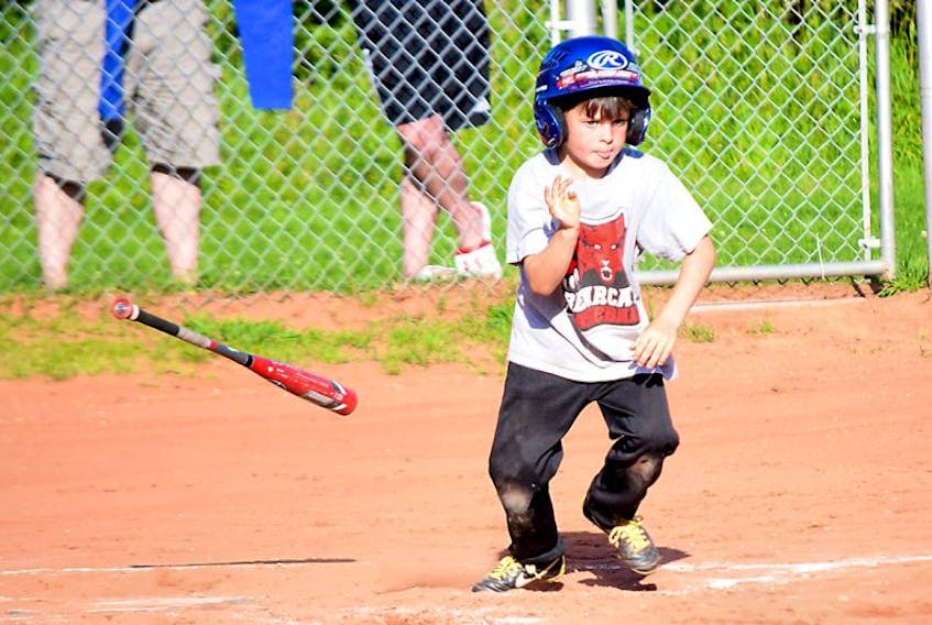 Eli Brown, 7, of Fundy Textiles drops the bat and heads to first after cracking the ball during action in the mosquito division of the Bible Hill-Truro Minor Baseball Association on Tuesday.