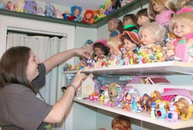 Sara Delaney straightens one of the toys in her collection. She finds spending time with her collection relaxing.