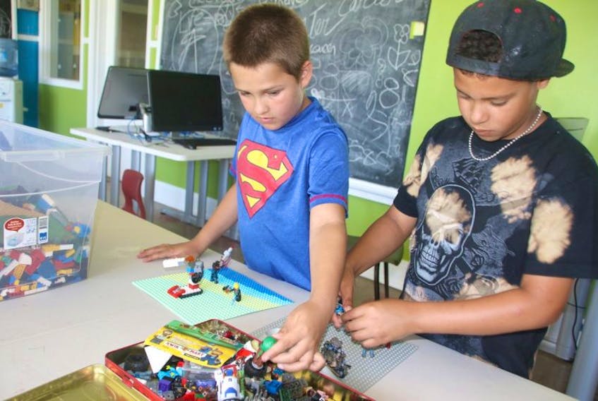 Owen Paris, left, and Kyah Lovell enjoy building with Lego at the Boys & Girls Club. The club opened in the Douglas Street Recreation Centre this month.