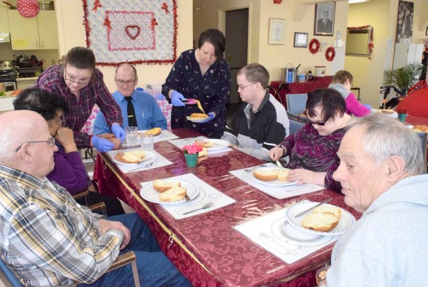 Participants in the VON Adult Day Program in Truro are seen preparing to have lunch during a break in activities on Friday. Pictured clockwise from the top of the photo are: Gerald Best, program coordinator Monique Natividad, Michael Burgess, Joanne Turple, Paul Roulston, Graham Lougheed, Nordicia Drummond and staff member Bonnie Joldersma.