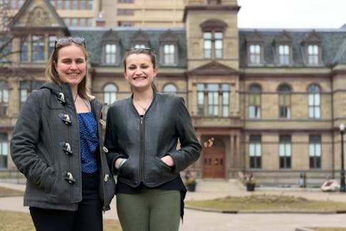 Lilian Barraclough and Riel Bjerke-Clarke pose for a portrait outside Halifax City Hall