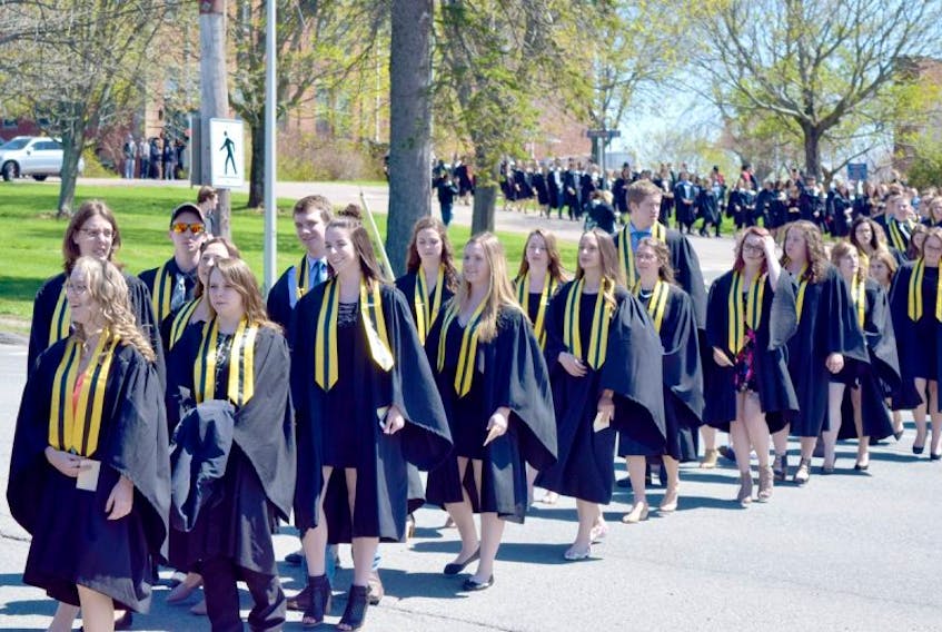 The Class of 2017 proceeds across the Agricultural Campus on their way to convocation ceremonies Friday in Bible Hill.