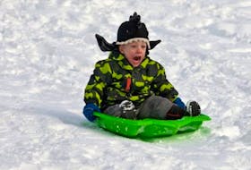 Felix Webber-Rillie, aged 3, yells as he speeds down the back side of the Citadel last winter.