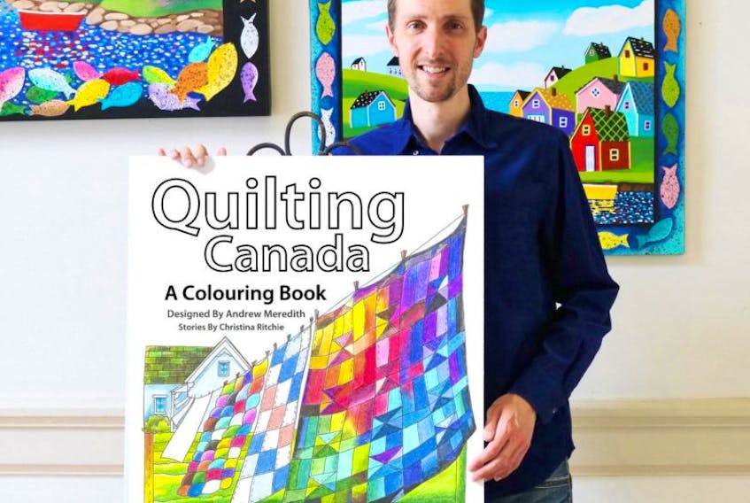 Andrew Meredith holds a poster showing the cover of his latest colouring book.