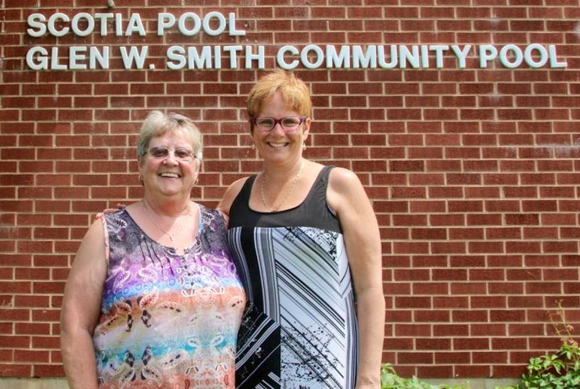 Brenda Geldart, left, secretary treasurer of the Scotia Pool Society, and Glenda Bower, chair of the board of directors, are pleased to have the name Glen W. Smith Community Pool added to the facility.