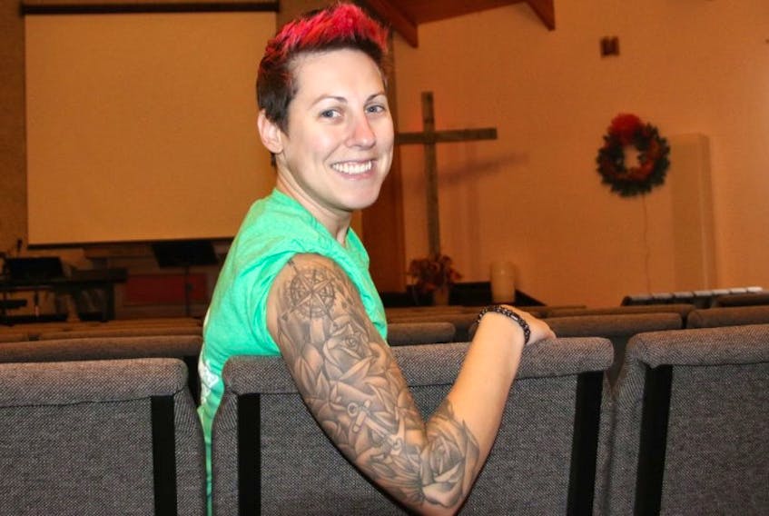 Lisa Gervais relaxes in the church sanctuary. She became assistant pastor at Connection (Wesleyan) Church in September.