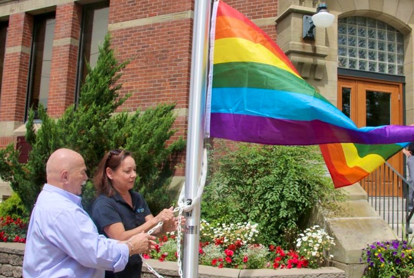 Al McNutt, supervisor at the Northern Healthy Connections Society, and Truro Deputy-Mayor Cheryl Fritz raised the rainbow flag in front of the Truro Civic Building, Monday afternoon.