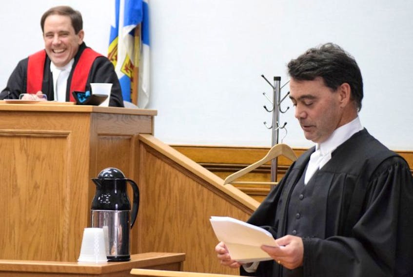 Nova Scotia’s newest bilingual provincial and family court judge and former Truro lawyer Al Bégin, left, shares laughter with the audience as he gets lightly roasted by longtime friend and Truro solicitor Ron Chisholm, during a swearing-in ceremony on Friday.