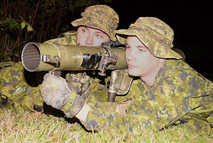 Cpl. Gavin Hamilton, left, and Cpl. Robert Weatherby, practise loading and unloading drills on an 84mm Carl Gustav recoilless rifle during Nova Scotia Highlanders reserves training at the Truro Armouries. This Saturday, the Canadian Army Reserves will hold an open house at the armouries building at 126 Willow St., Truro, from 9 a.m. to 3 p.m.