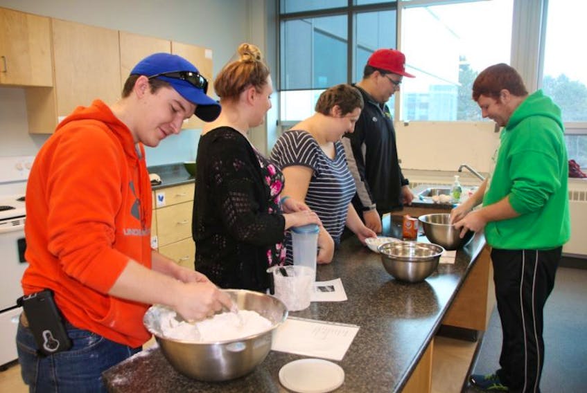 Students in the NSCC Achieve program have been preparing food for the homeless shelter recently. Some of the students are, from left, Luke Dillman, Dominique Crowe, Katy Crawford, Therin Nevin and Bradley MacDonald Stone. A total of 10 young people take part in the course.
