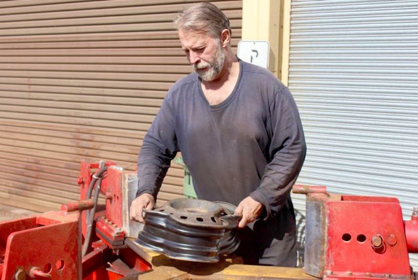 While most wheel crushing machines depend on one arm crushing the rim in half, Wayne Smith’s system uses a three-arm setup, making the machine more efficient, and cutting the crushing process in half. The machine is built on a trailer, making it completely portable.