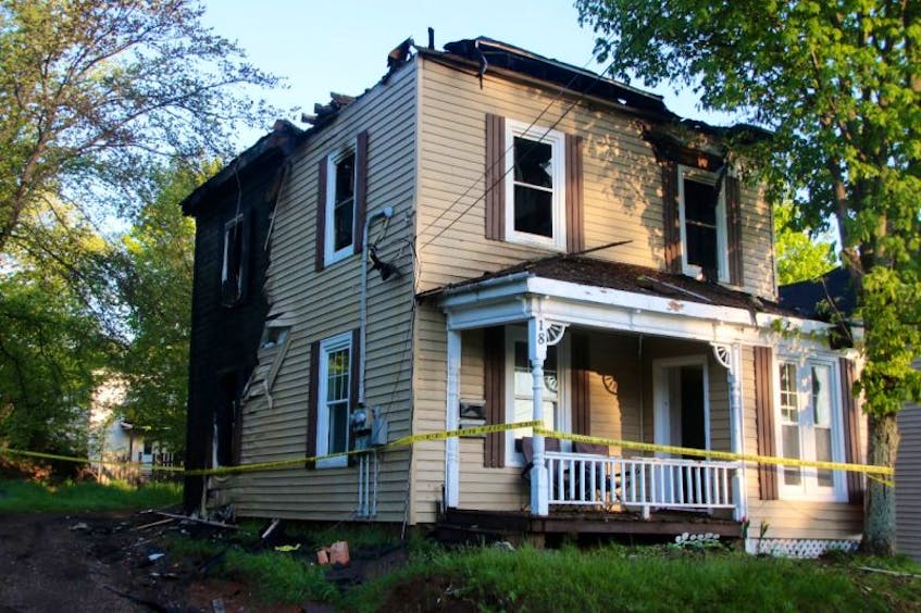 A Truro woman is facing arson charges in relation to a May 28 fire at the house pictured above on Laurie Street. The house containing four apartments was extensively damaged by the fire.