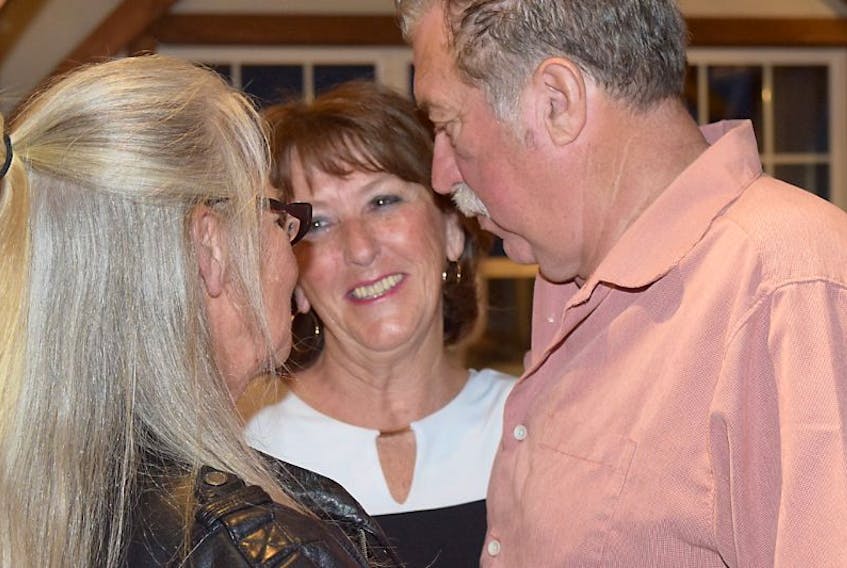 Natalie and Bill Elliott offer their congratulations to Liberal MLA-elect Karen Casey on Tuesday night shortly after it had been confirmed that she would retain her seat in Colchester North.