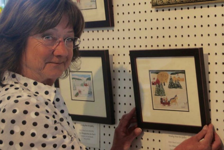 Collette Samson is thrilled to have silk-screened prints and framed art cards of Maud Lewis’s painting for sale at the Winding River Art Gallery.