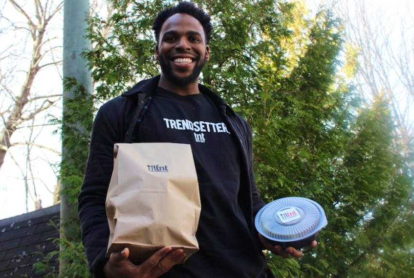 <p><span class="BodyText">Dylan DesRoche/The Guardian</span></p>
<p><span class="BodyText">Terrence Taylor is ready to deliver some of the freshly made food from the TnT experience. Taylor started the company with partner Danielle Kok to promote healthy eating.</span></p>