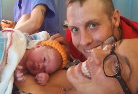 Andrew and Jenna Todd at the hospital with daughter Rosaleigh. The Todd family has faced many obstacles in Andrew's rowing journey. Contributed