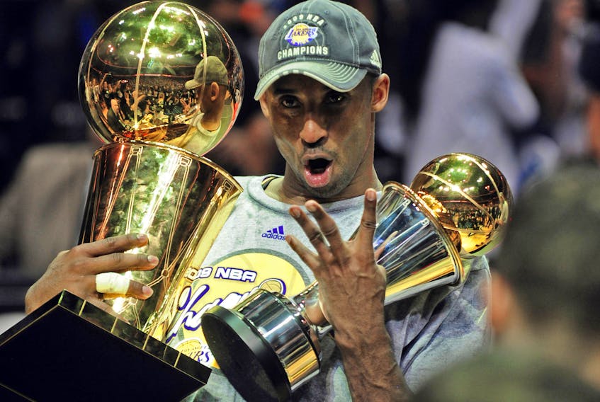 Kobe Bryant of the Los Angeles Lakers celebrates victory following Game 5 of the NBA Finals against the Orlando Magic at Amway Arena on June 14, 2009 in Orlando, Florida. The Lakers won the National Basketball Association championships defeating Orlando 99-86 for their 15th title and first since 2002. Bryant had 30 points, eight rebounds and six assists as the Lakers completed a four-games-to-one victory in the best-of-seven NBA Finals.  AFP