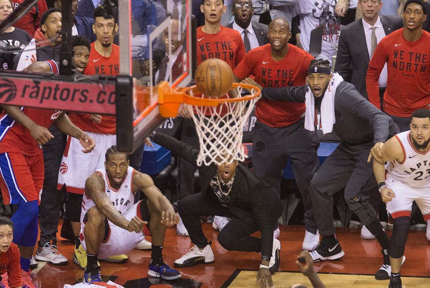 Former Raptor Kawhi Leonard watches as his game-winning ball goes in to clinch the series against the 76ers last year. 