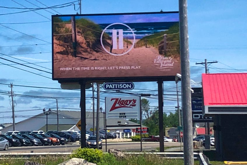 A digital billboard advertisement for tourism in Prince Edward Island is shown on Kings Road in Sydney River this week. The promotion reads “When the time is right, let’s press play” meaning when restrictions are lifted, and travel is safe between provinces, to visit P.E.I. Nova Scotia has not yet promoted its tourism industry in other provinces for the 2020 season. JEREMY FRASER/CAPE BRETON POST
