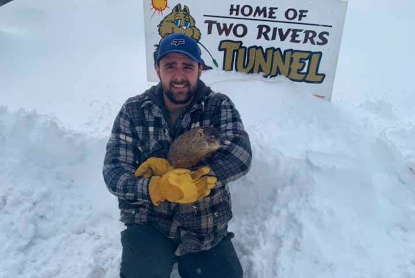 There are many activities underway throughout the winter at Two Rivers Wildlife Park, including the annual Groundhog Day activities. Park assistant manager Jarrett Lewis is shown with Two Rivers Tunnel during this year’s activities. CONTRIBUTED/TWO RIVERS WILDLIFE PARK