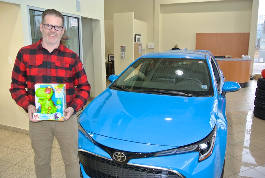 Glenn Roberts, owner and dealer principle of Amherst Toyota, holds a toy that has been collected for the 10th Amherst Toyota Toy Drive. People can bring new toys to Giant Tiger, Walmart and Amherst Pharmasave or to the dealership on Lord Amherst Drive.