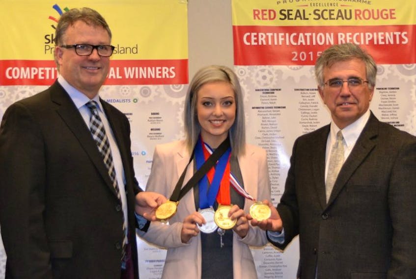 <p>Education, Early Learning and Culture Minister Doug Currie, left, and&nbsp;Workforce and Advanced Learning Minister Richard Brown are shown with award-winning Westisle cosmetology graduate Mary Beth Perry Monday in Charlottetown</p>