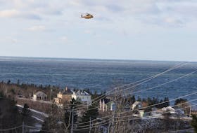 A Cormorant SnR helicopter is seen while conducting a search for the 5 remaining crew members of the Chief William Saulis, which sank yesterday...seen near Parker's Cove, NS Wednesday December 16, 2020.

TIM KROCHAK PHOTO 