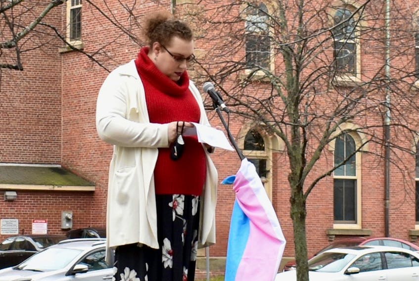 Anastasia Preston reads her opening remarks at the flag-raising ceremony marking Transgender Day of Remembrance outside the Cole Building in Charlottetown on Nov. 20