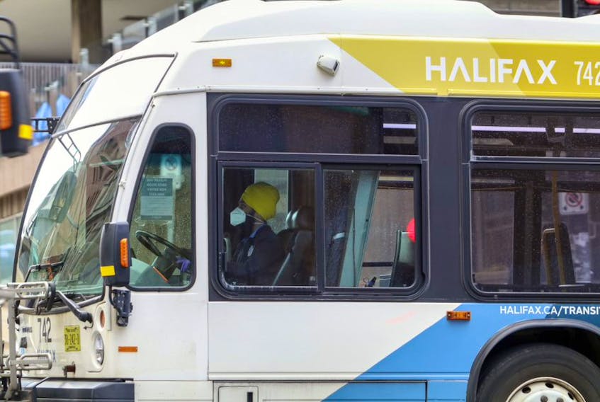 A bus driver wears a face mask as he travels along Barrington Street in Halifax on Wednesday. A Halifax Transit driver has tested positive for COVID-19.
ERIC WYNNE/Chronicle Herald