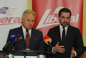 Liberal party president John Allan (left) and Liberal committee member John Samms detail the rules of the 2020 Liberal leadership race at the Capital Hotel on Monday. JOE GIBBONS/THE TELEGRAM