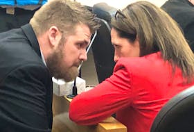 Jeffrey Fowler, 32, speaks with his lawyer, Rosellen Sullivan, before his trial in provincial court in St. John’s begins Monday morning. Fowler has pleaded not guilty to charges of child luring and making sexually explicit material available to a child. Tara Bradbury/The Telegram