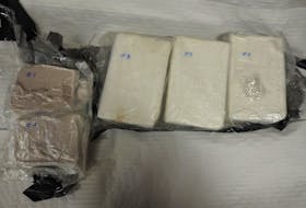 The compacted substance police say was seized from Tyneich Allen's baggage was later confirmed to contain a total of three kilograms of cocaine and one kilogram of fentanyl. - Royal Newfoundland Constabulary photo