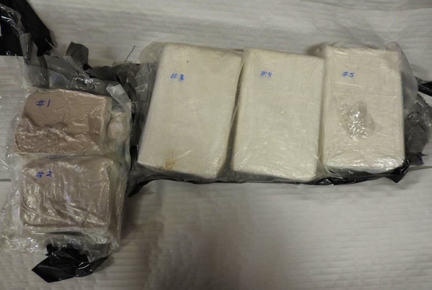 The compacted substance police say was seized from Tyneich Allen's baggage was later confirmed to contain a total of three kilograms of cocaine and one kilogram of fentanyl. - Royal Newfoundland Constabulary photo