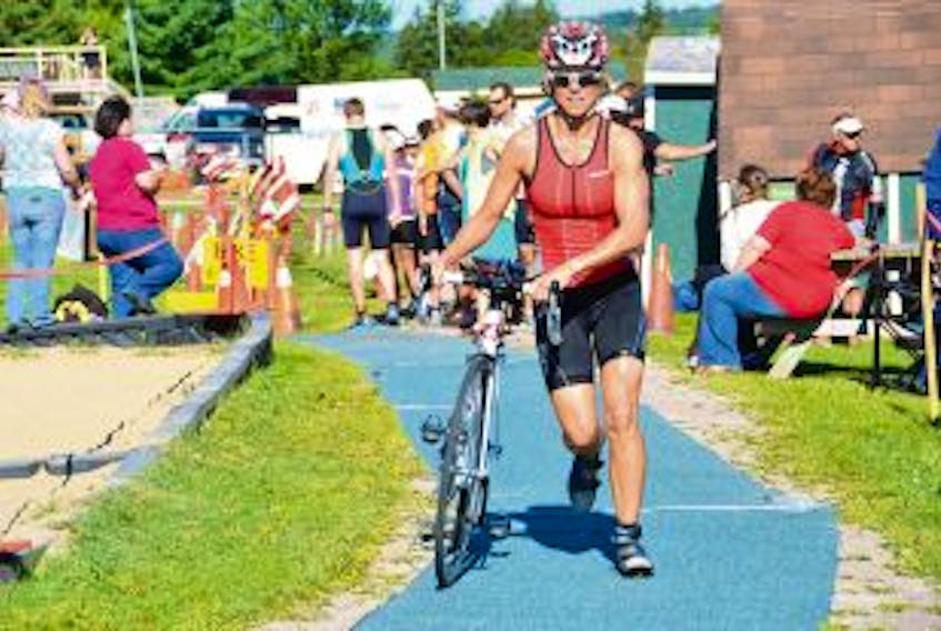 ['Sarah Quintin heads out on the bike portion of last year’s Sackville Triathlon. This year’s event is scheduled for Saturday, Aug. 23.']