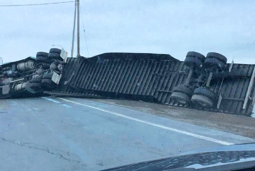 A tractor trailer overturned at the Highway 102-104 intersection Thursday evening.