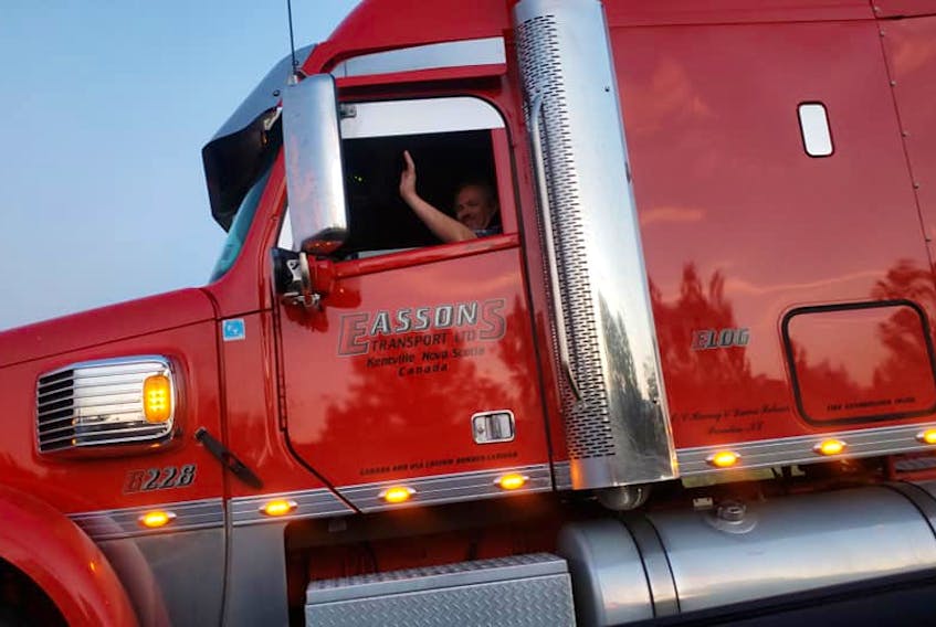Clarissa Flint took this photo of Harvey Palmer- a long-haul trucker who works for Kentville-based company Eassons, as he waved and honked his horn to distract her young son while they were stuck in a traffic jam in Ontario. - Clarissa Flint/Facebook