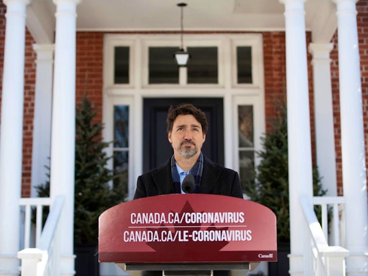 Prime Minister Justin Trudeau speaks at a press conference about COVID-19 in front of his residence at Rideau Cottage on the grounds of Rideau Hall in Ottawa, on Sunday, March 22, 2020.