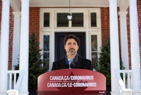Prime Minister Justin Trudeau speaks at a press conference about COVID-19 in front of his residence at Rideau Cottage on the grounds of Rideau Hall in Ottawa, on Sunday, March 22, 2020.