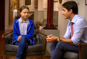 Prime Minister Justin Trudeau greets Swedish climate change teen activist Greta Thunberg before a climate strike march in Montreal on  Sept. 27, 2019.  