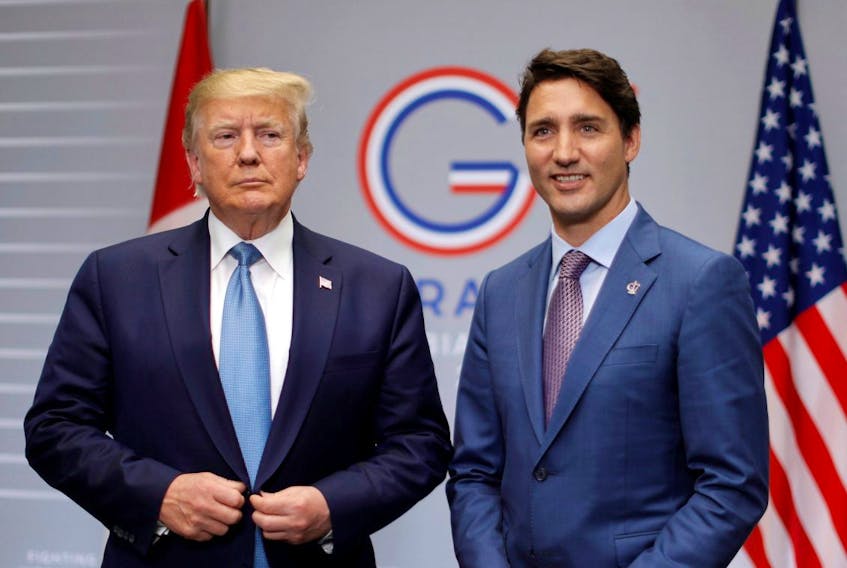 U.S. President Donald Trump, left, and Prime Minister Justin Trudeau hold a bilateral meeting during the G7 summit in Biarritz, France, August 25, 2019. REUTERS/Carlos Barria  
