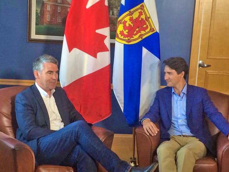 Prime Minister Justin Trudeau (right) chats with Nova Scotia Premier Stephen McNeil, shortly after his arrival at St. F.X. in Antigonish early Wednesday afternoon. The PM will join Central Nova MP Sean Fraser, over the next couple hours, for a community barbecue on the university campus. Early today, in Pictou County, Trudeau announced $90 million in federal funding to help finance the twinning of a stretch of Trans-Canada Highway 104, from Sutherland's River to Antigonish. Sam Macdonald