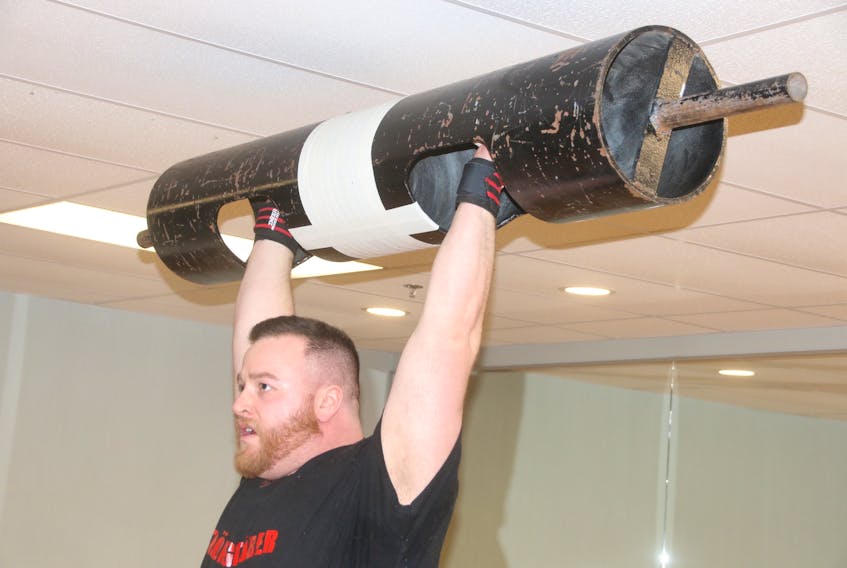 Dillon Fraser lifts a 185-pound log bar. The Truro man works out at the gym about five days a week to prepare for strongman competition. LYNN CURWIN/TRURO NEWS