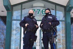 Cst. Olivia MacPhee and Cst. Amanda Assoun outside of the doors of the Truro Police Station. The lobby inside those doors is offered as a safe meeting place for exchanges arranged online or by phone.