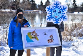 Town of Truro Special Events co-ordinator Megan Burgess is joined by the Truro Long John Festival mascot near one of the last couple of pages of Hank’s Ball; the storybook used for the Story Trail initiative set-up around Kiwanis Park pond. As folks stroll around the pond on the cleared path, they can read and check out the illustrations for the book, about grief, created by local authors Sam Madore and Joey Schurman and illustrator Amanda Bent.