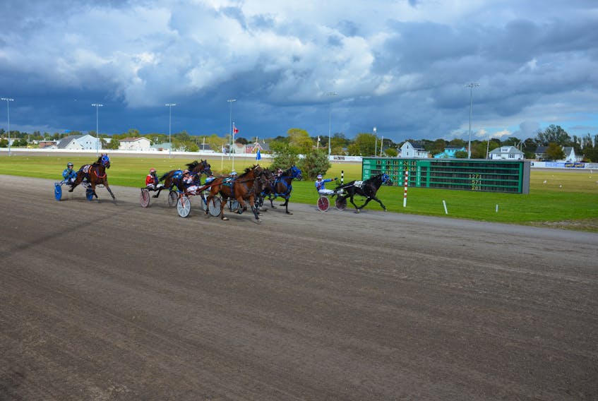 Co-owner and trainer Walter Cheverie drove Nogreatmischief, left, to a photo finish victory in the featured $2,700 pace at Red Shores at Summerside Raceway on Sunday afternoon. Time of the mile was 1:57.2.
