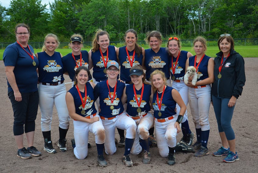 The host Township Tigers won the 2019 Eastern Canadian women’s intermediate softball championship in O’Leary on Sunday afternoon. The Tigers edged the Dartmouth She Devils 9-8 in the final. Members of the Tigers are, front row, from left: Lauren Lilly, Abby Hustler, Ally Hustler and Brooke Bernard. Back row: April Hustler (coach), Brianna Arsenault, Eryn Hustler, Katie Rayner, Sarah Woodside, Vanessa Rennie, Drew Hackett, Marley Gaudet (with puppy Cobra) and Della Sweet (coach).