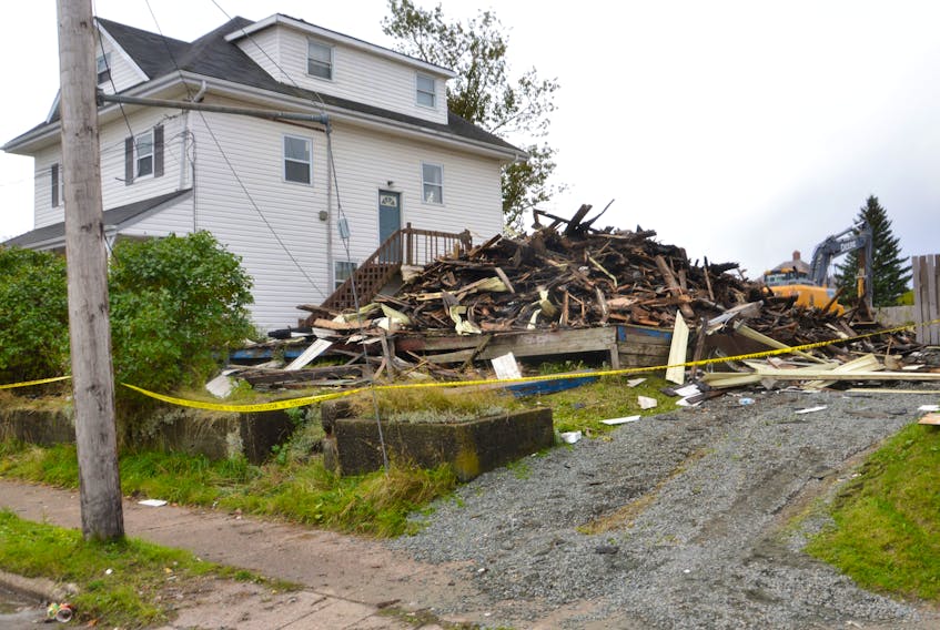 Only a pile of rubble remained on Wednesday morning after a structure fire Tuesday evening at 823 Victoria Rd. in Whitney Pier. GREG MCNEIL/CAPE BRETON POST 
