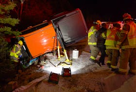 Two people were extricated from pickup after it overturned on an icy road in St. John's Thursday night. Keith Gosse/The Telegram